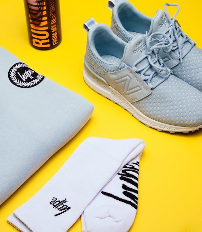 Branded socks, shoes, sweater, and water bottle