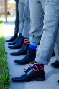 groomsmen wearing different socks