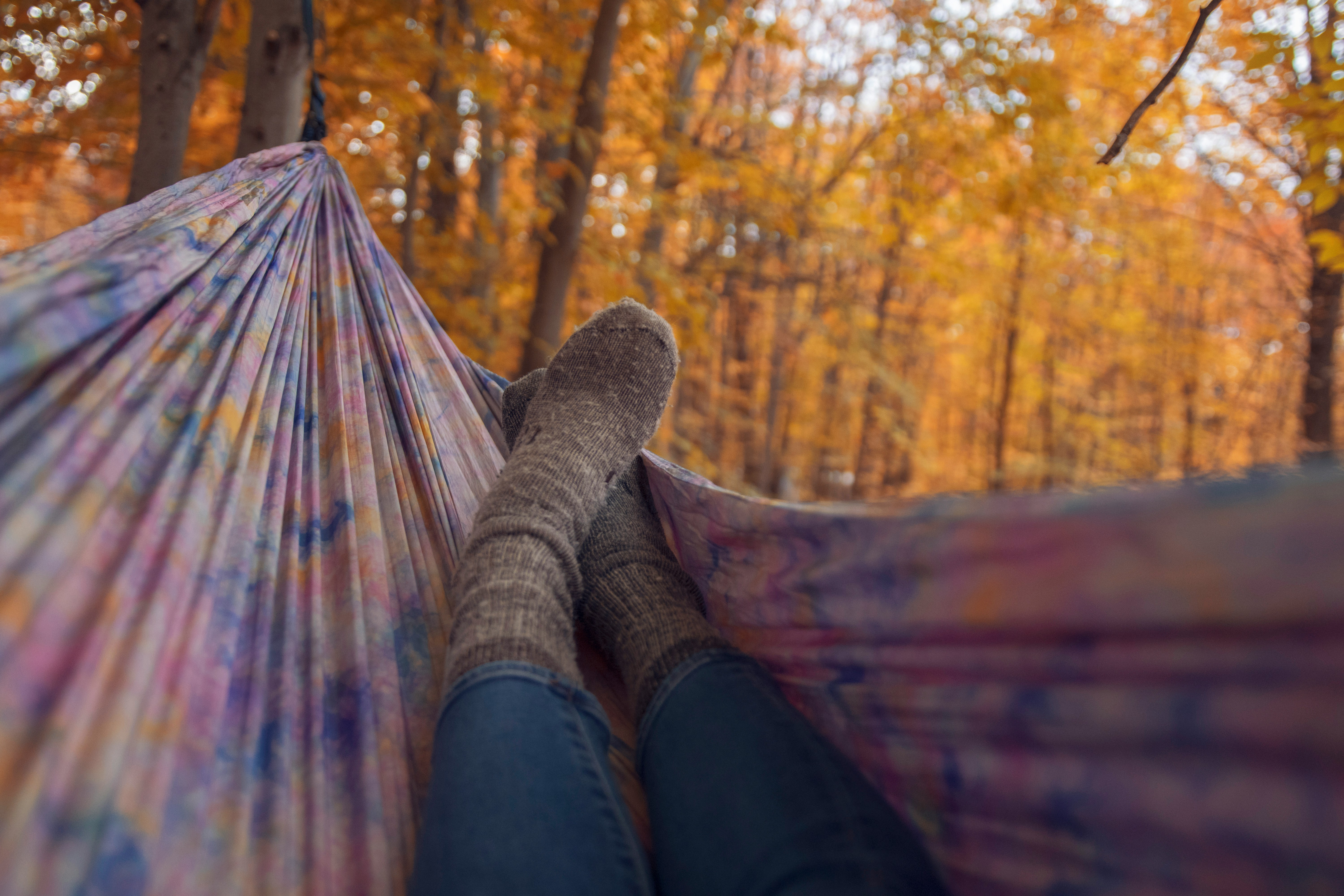 person with wool sock in hammock