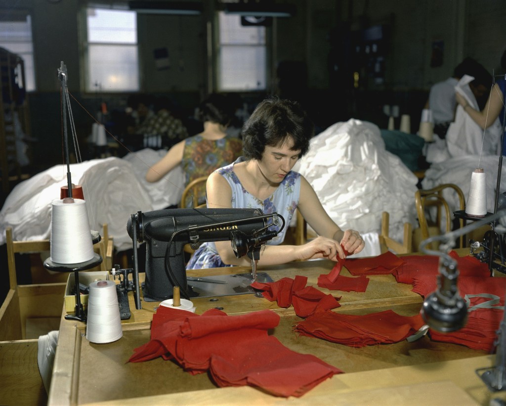 woman using sewing machine 
