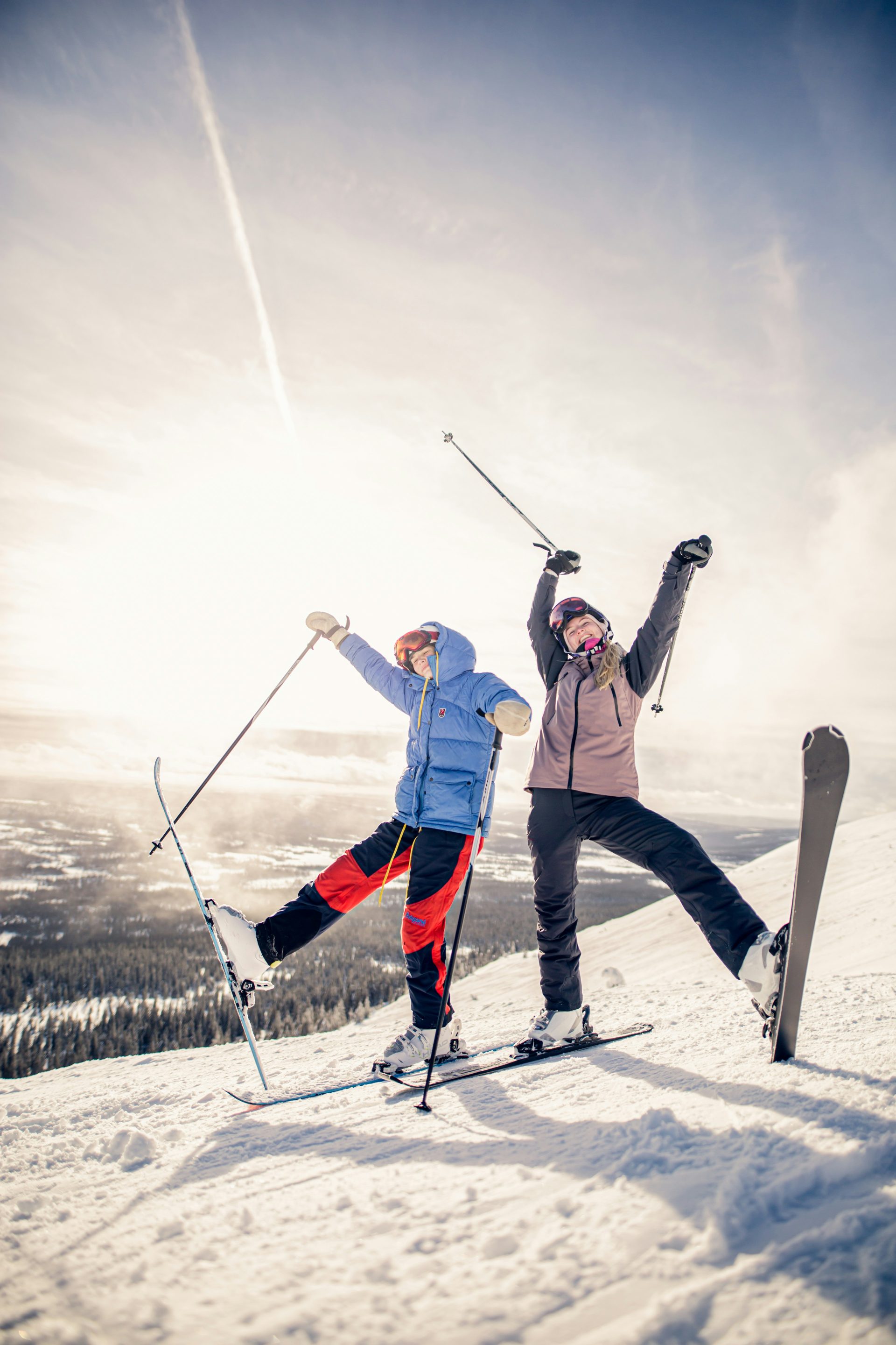 excited ski girls on mountain